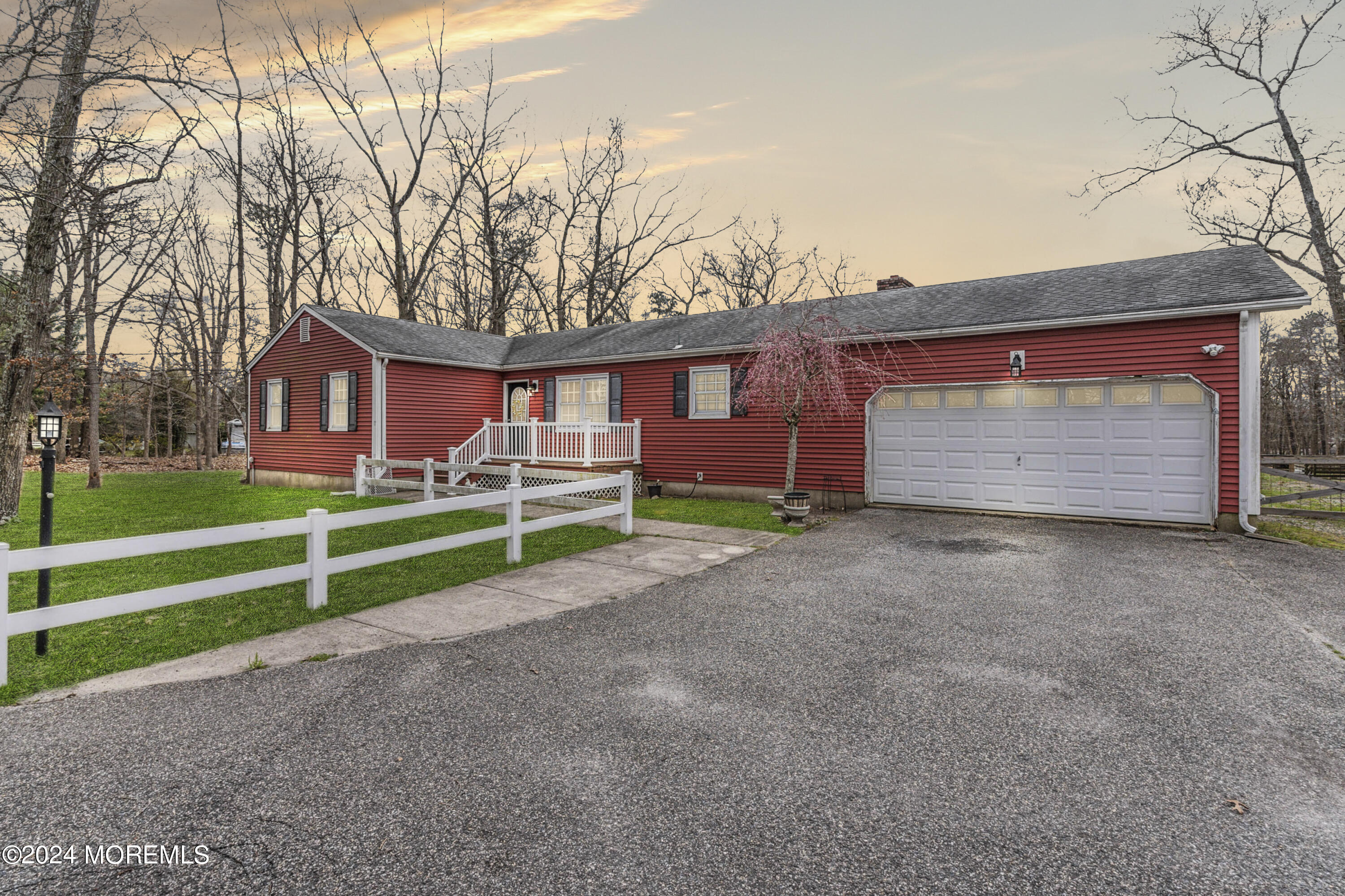 112 Porter Road Howell, NJ 07731 - Photo 2 of 39 a front view of a house with a yard and garage