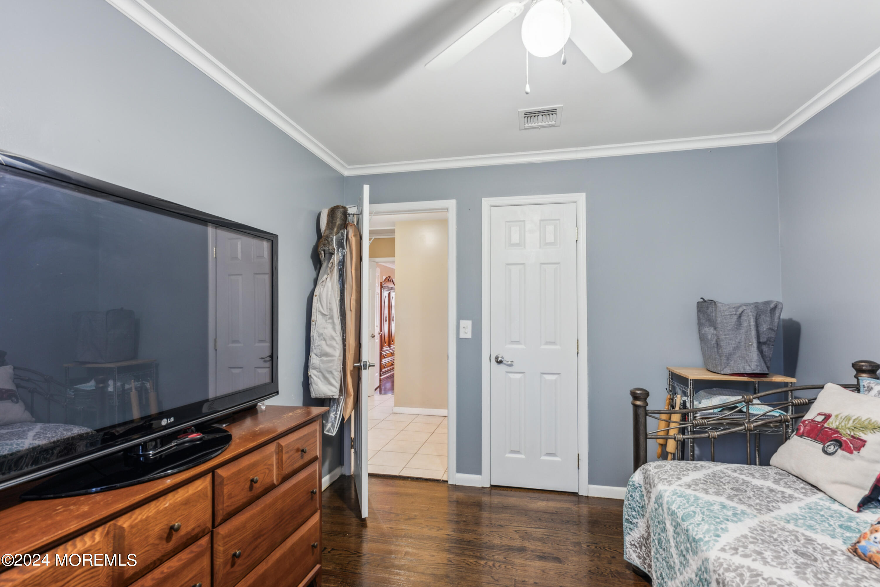 112 Porter Road Howell, NJ 07731 - Photo 22 of 39 a bedroom with a bed and wooden floor