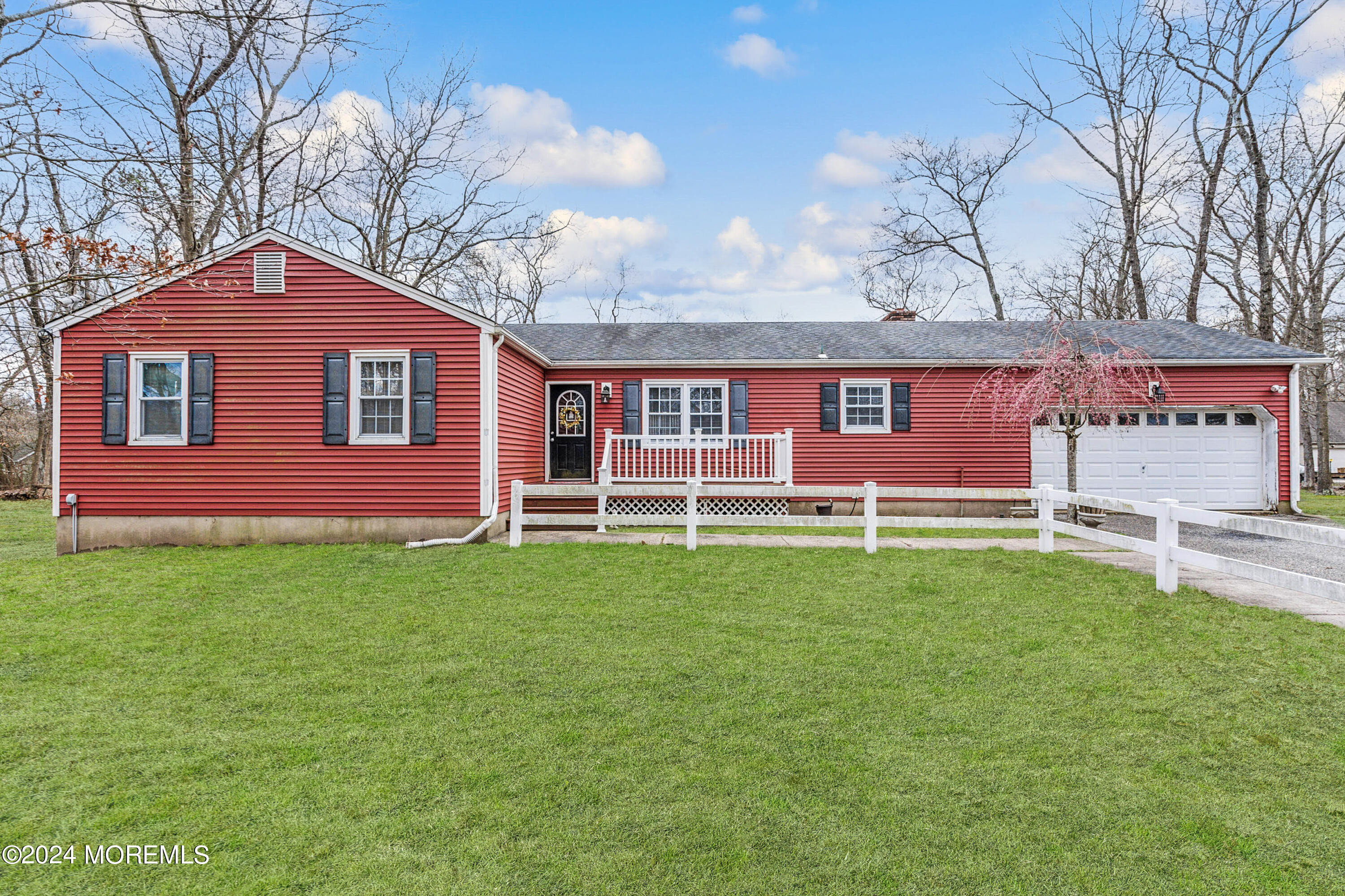 112 Porter Road Howell, NJ 07731 - Photo 4 of 39 a front view of a house with a garden
