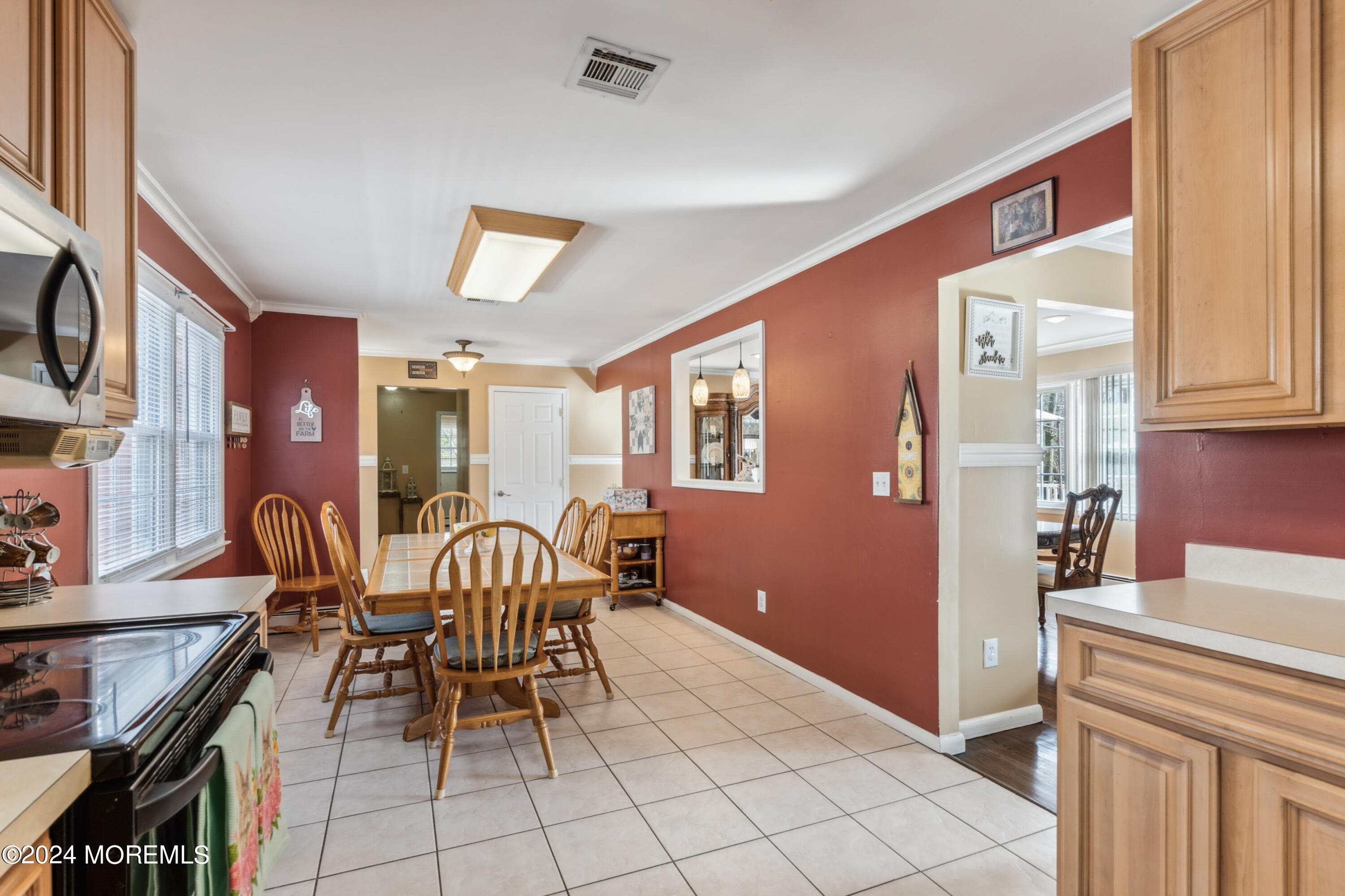 112 Porter Road Howell, NJ 07731 - Photo 8 of 39 a dining room with furniture and chandelier