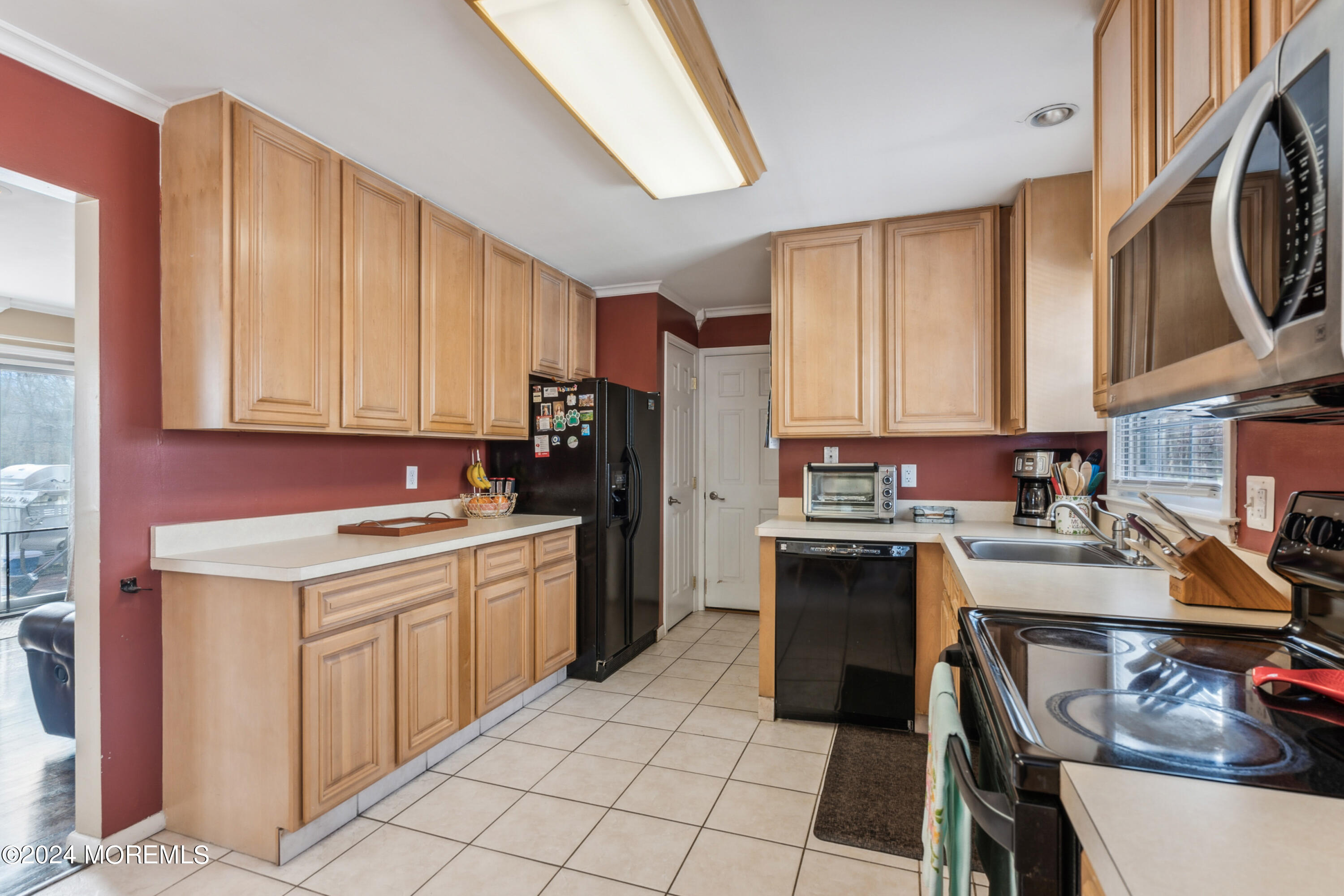 112 Porter Road Howell, NJ 07731 - Photo 9 of 39 a kitchen with a sink cabinets and appliances