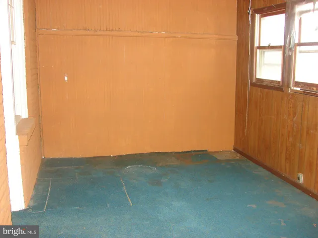 a bed room with a bed and a window