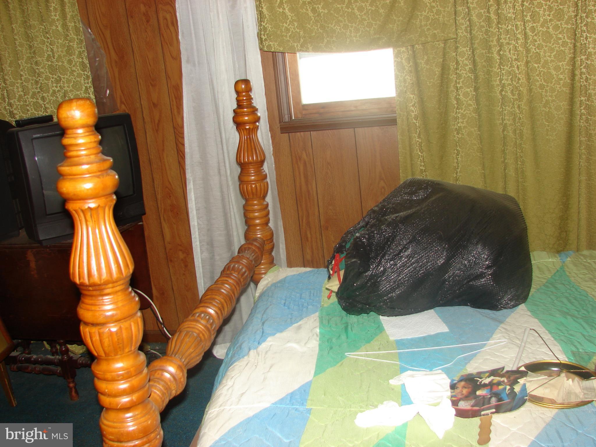 415 Farragut Street Northwest Washington, DC 20011 - Photo 15 of 27 a bed room with a bed and a window