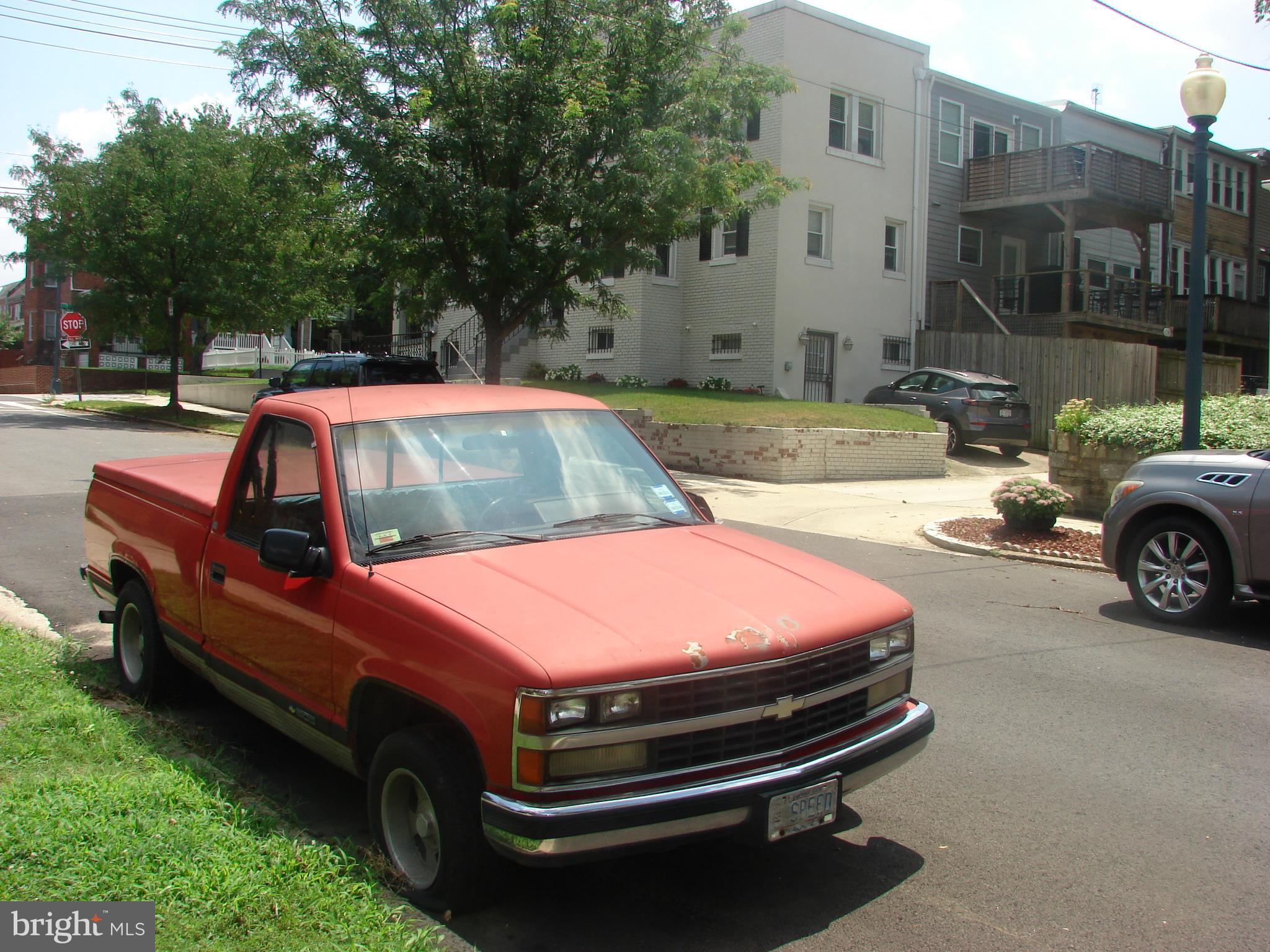 415 Farragut Street Northwest Washington, DC 20011 - Photo 17 of 27 a view of a yard with a car parked in it