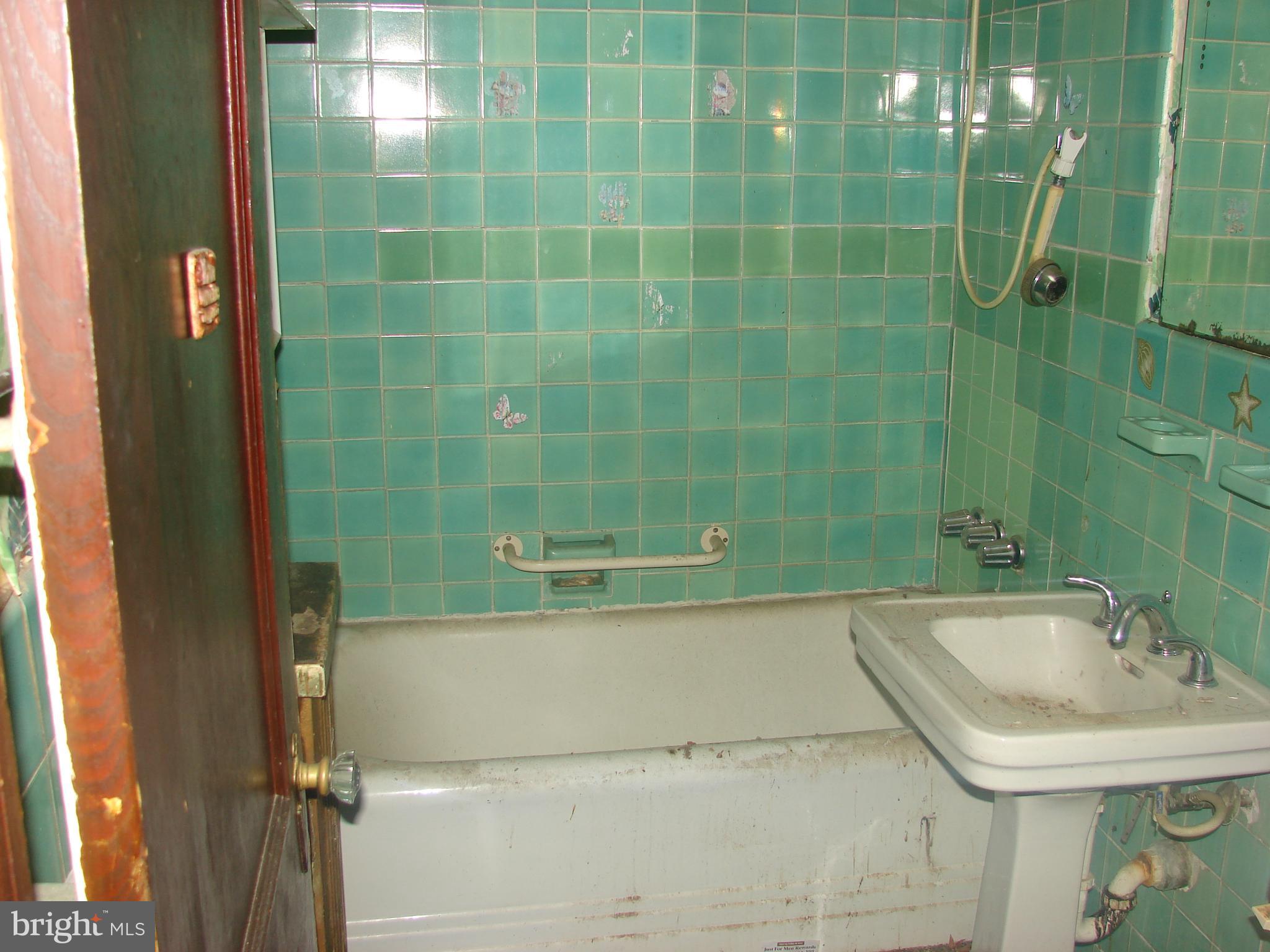 415 Farragut Street Northwest Washington, DC 20011 - Photo 21 of 27 a bathroom with a sink and a shower