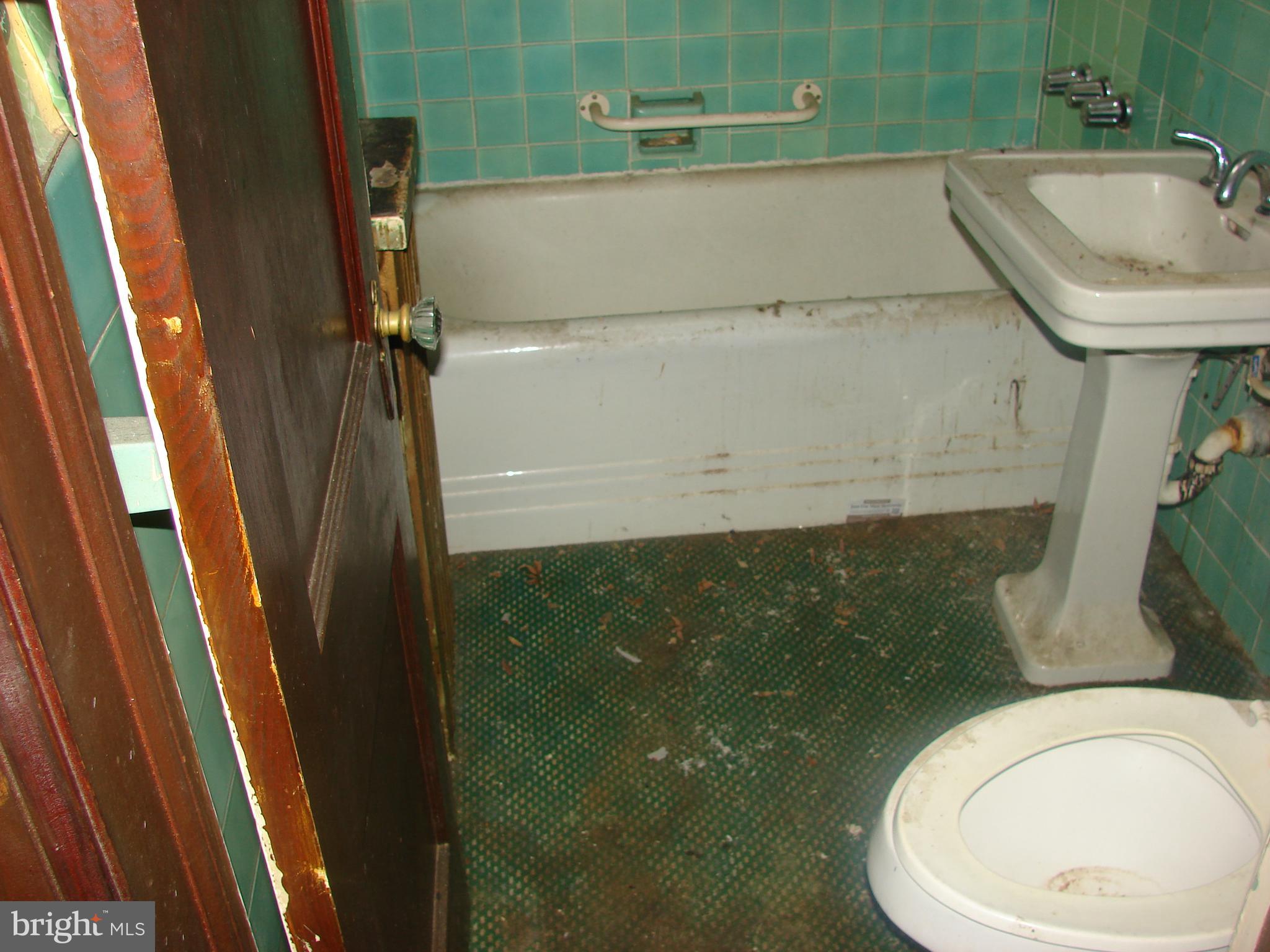 415 Farragut Street Northwest Washington, DC 20011 - Photo 24 of 27 a bathroom with a sink and a toilet