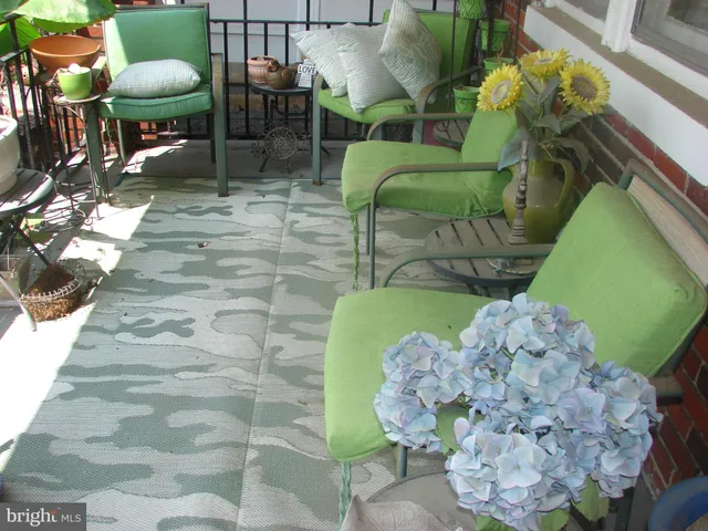 a view of a chairs and table in patio