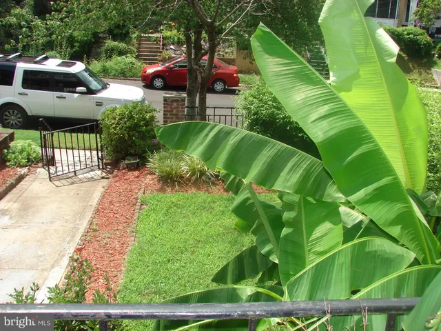 a hallway with a fireplace and cabinets