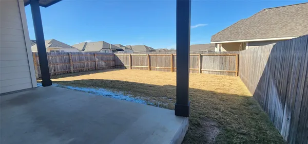a view of a backyard of the house