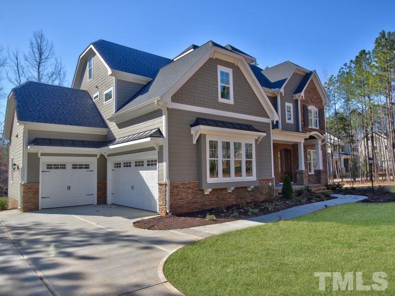 2117 Old Sorrell Road Apex, NC 27539 - Photo 1 of 25 Gorgeous custom built home in tranquil setting! Lake Wheeler sits just beyond the treeline! Awesome 3 car garage!