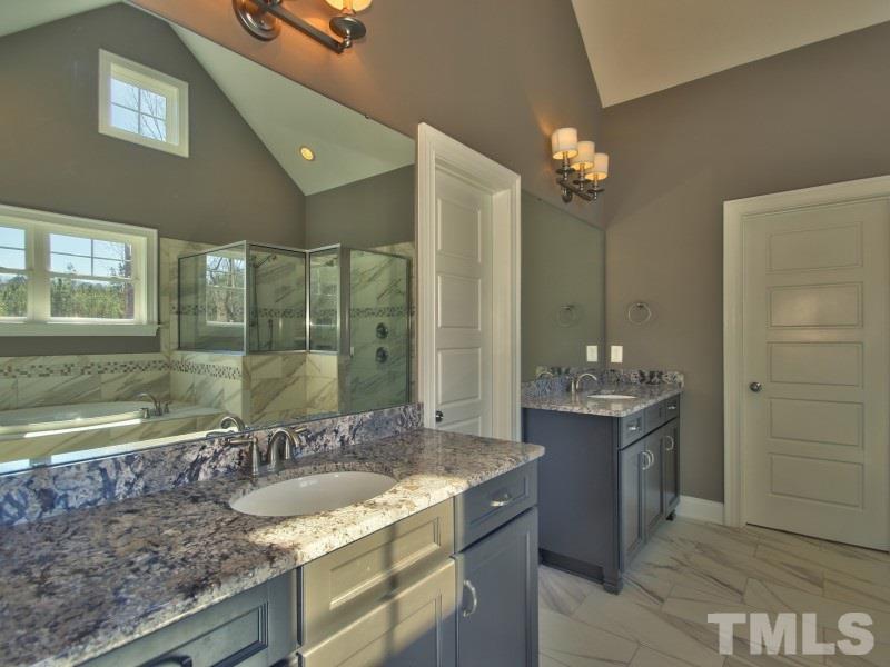 2117 Old Sorrell Road Apex, NC 27539 - Photo 10 of 25 Huge private master bath with granite, dual sinks and vaulted ceiling.