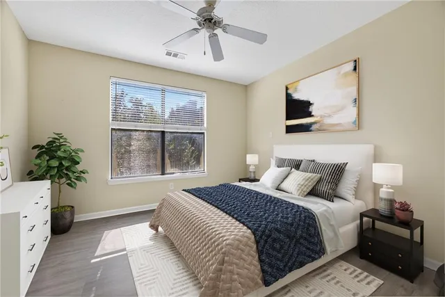 a bedroom with a bed and a window