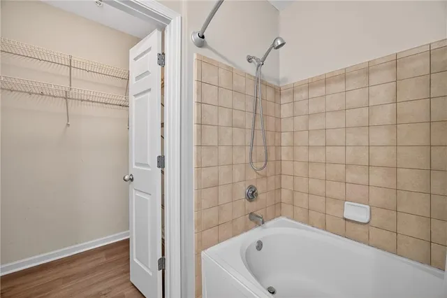 a bathroom with a bathtub and shower