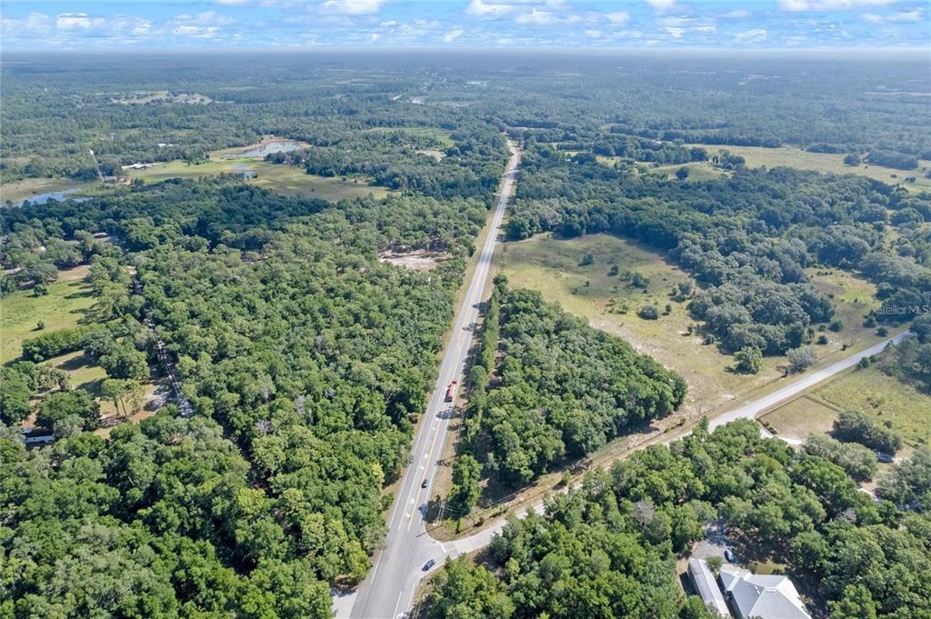 29901 State Road 44 Eustis, FL 32736 - Photo 21 of 24 an aerial view of a houses with a yard