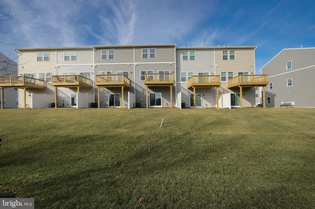 a view of a big yard with an outdoor seating