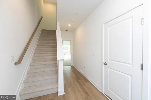 a view of a hallway with staircase