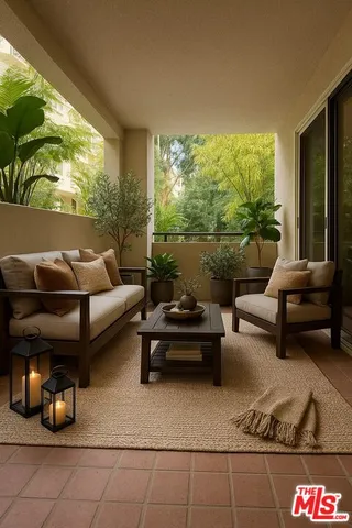 a outdoor living space with furniture and a rug