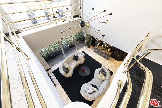 a view of a street with a building and a street sign