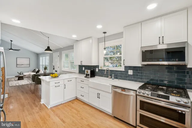 a kitchen with a stove sink and microwave