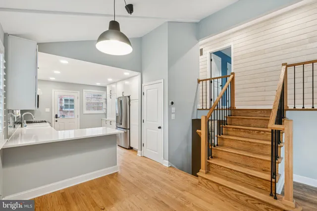 a view of a living room and entry way