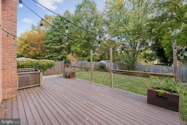a view of a deck with chair and wooden floor