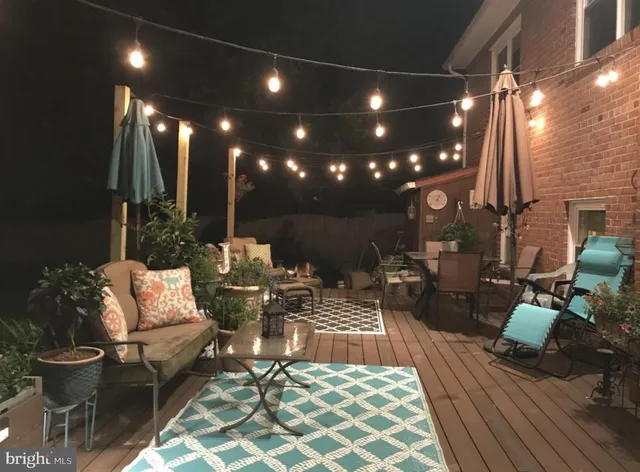 a outdoor living space with furniture and a potted plant