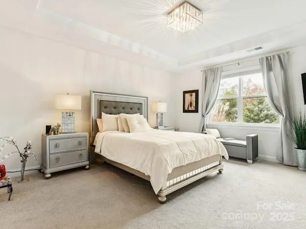 a bed room with furniture and a window