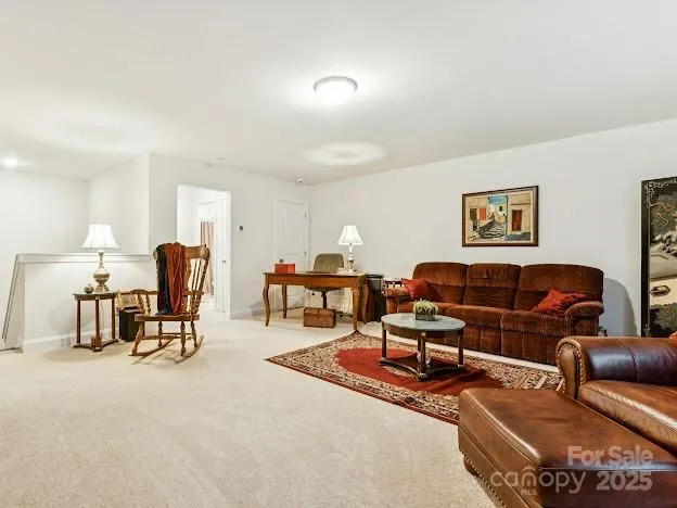 a living room with furniture and a lamp