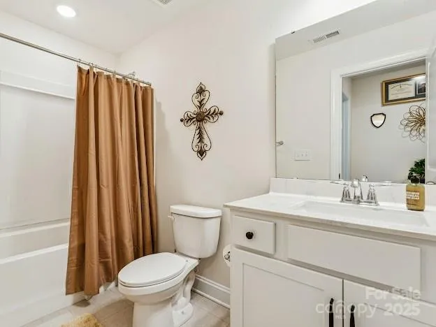 a bathroom with a granite countertop sink toilet and a mirror