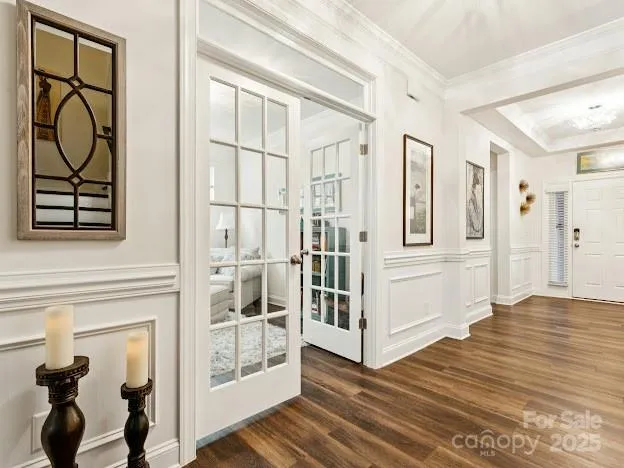 a view of an entryway with wooden floor