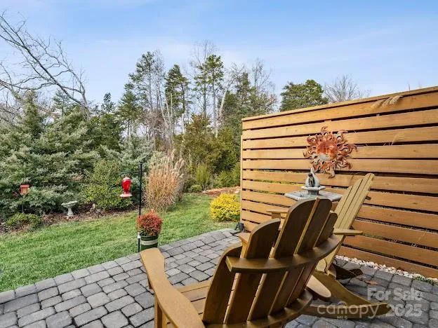 a view of a chairs and tables in the yard