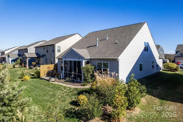 a view of a house with wooden fence
