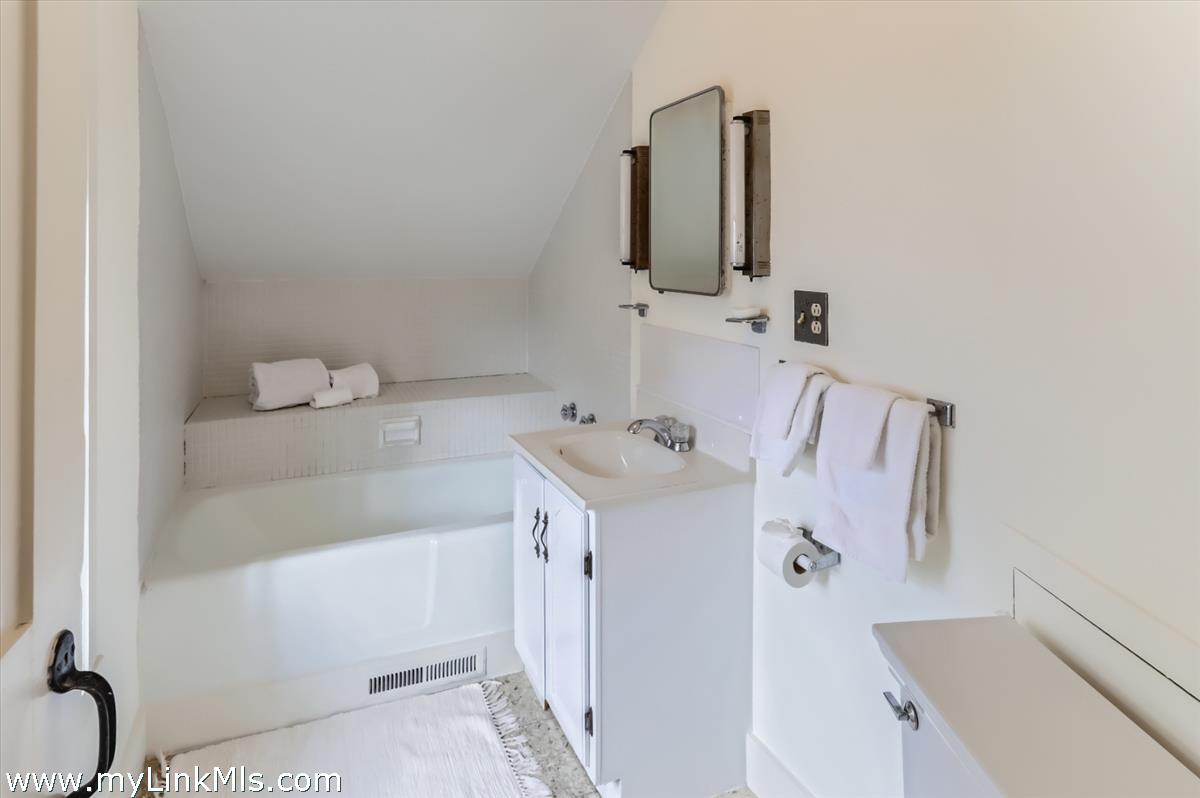 27 Spring Street Vineyard Haven, MA 02568 - Photo 47 of 58 a bathroom with a sink and a mirror