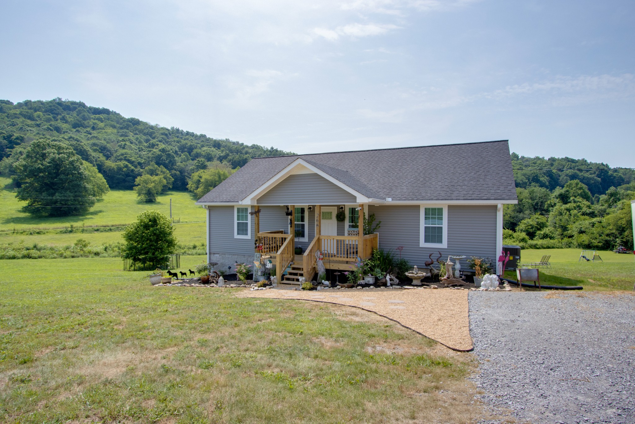 266 Buffalo Road Carthage, TN 37030 - Photo 4 of 35 a front view of a house with yard and outdoor seating