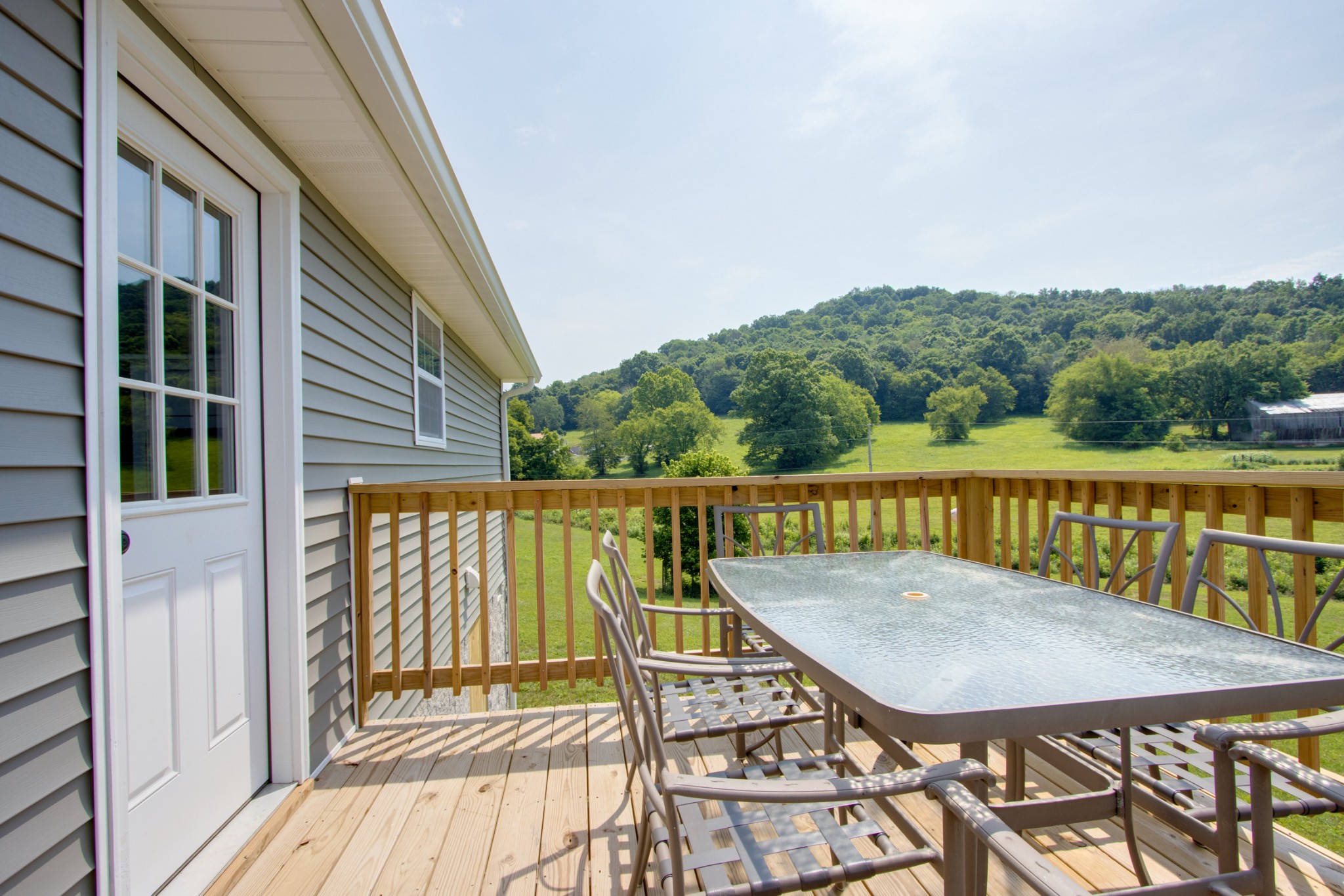 266 Buffalo Road Carthage, TN 37030 - Photo 33 of 35 a view of a balcony with a table and chairs