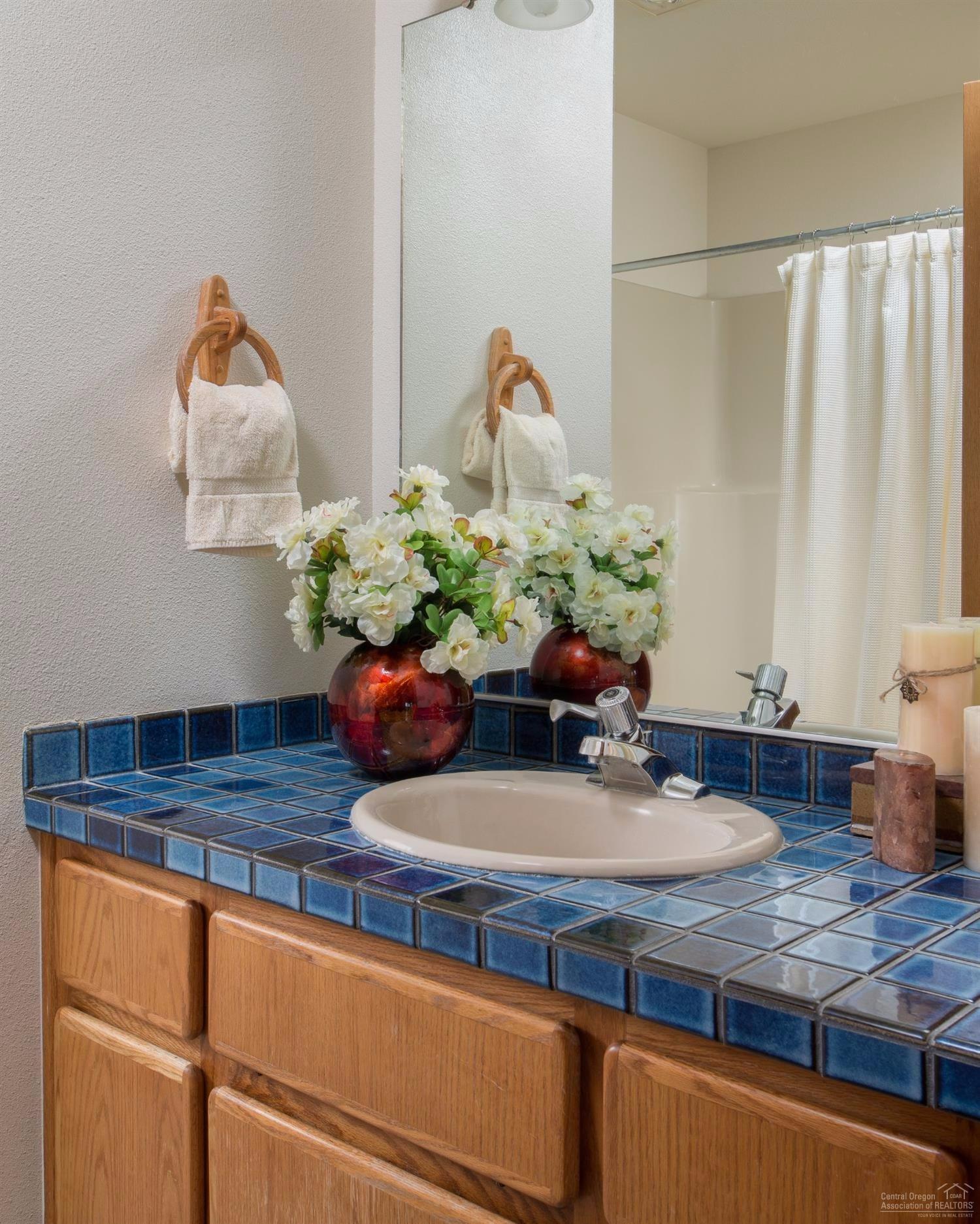 56872 River Road Sunriver, OR 97707 - Photo 19 of 21 The guest bathroom is spacious and well