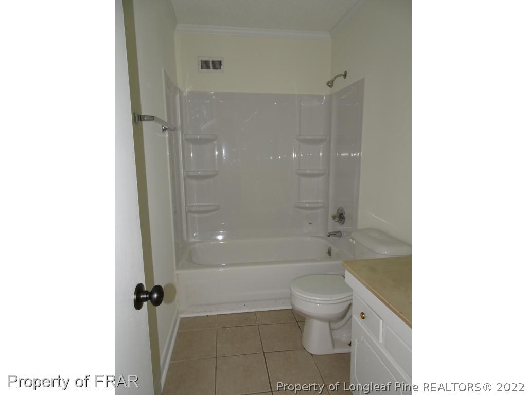 571 F Winding Creek Road Fayetteville, NC 28305 - Photo 12 of 15 a bathroom with a toilet and a shower
