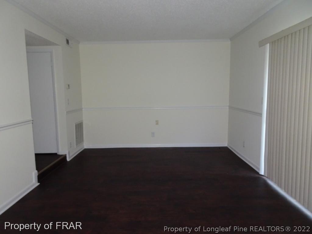 571 F Winding Creek Road Fayetteville, NC 28305 - Photo 7 of 15 a view of an empty room with wooden floor