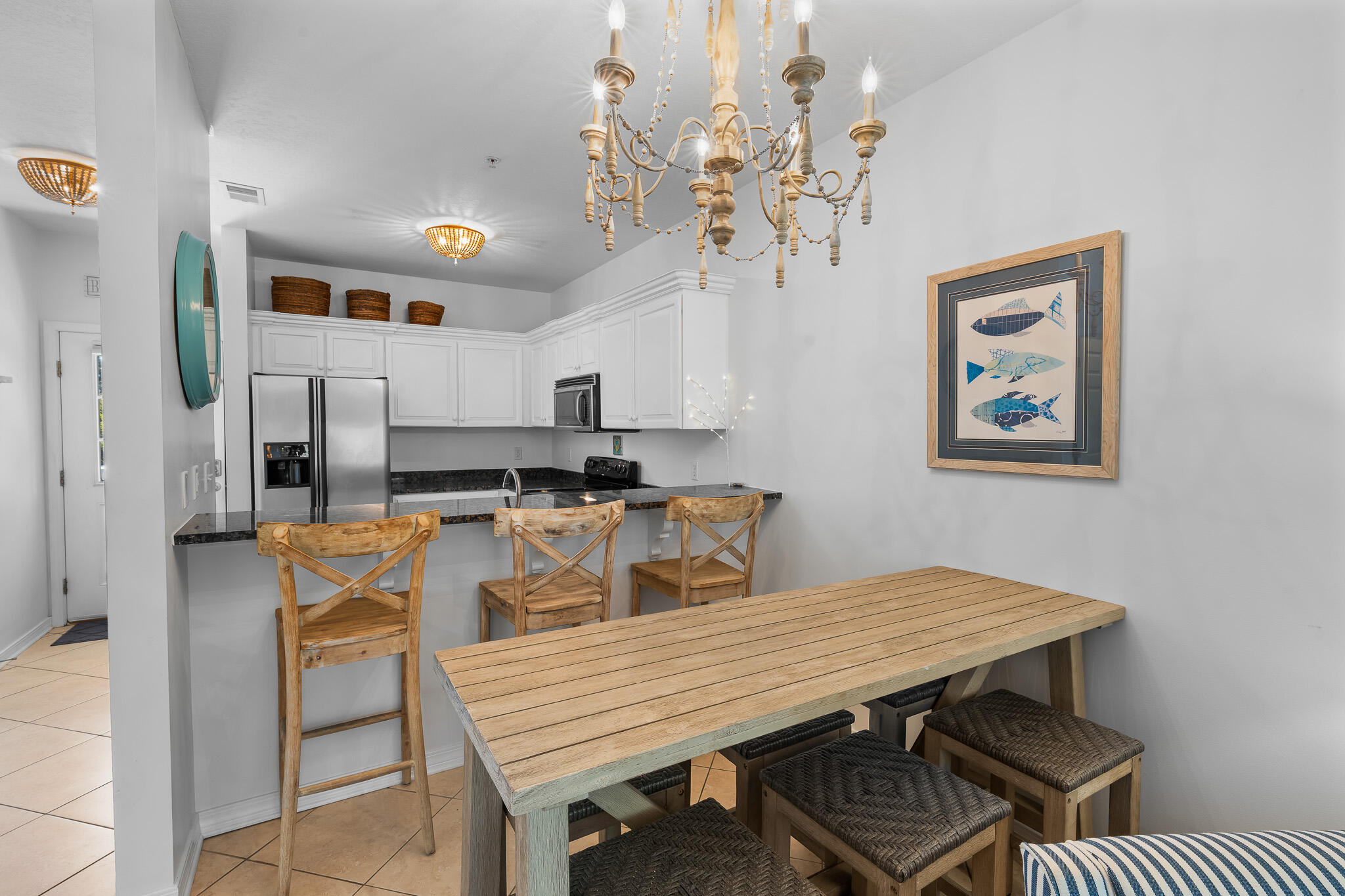 34 Heron's Watch Way, Unit 7205 Santa Rosa Beach, FL 32459 - Photo 2 of 49 a dining room with wooden floor and chandelier