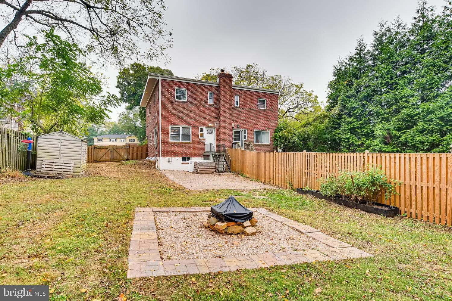 5723 Pimlico Road Baltimore, MD 21209 - Photo 22 of 25 Large flat rear yard with patio and fire pit area