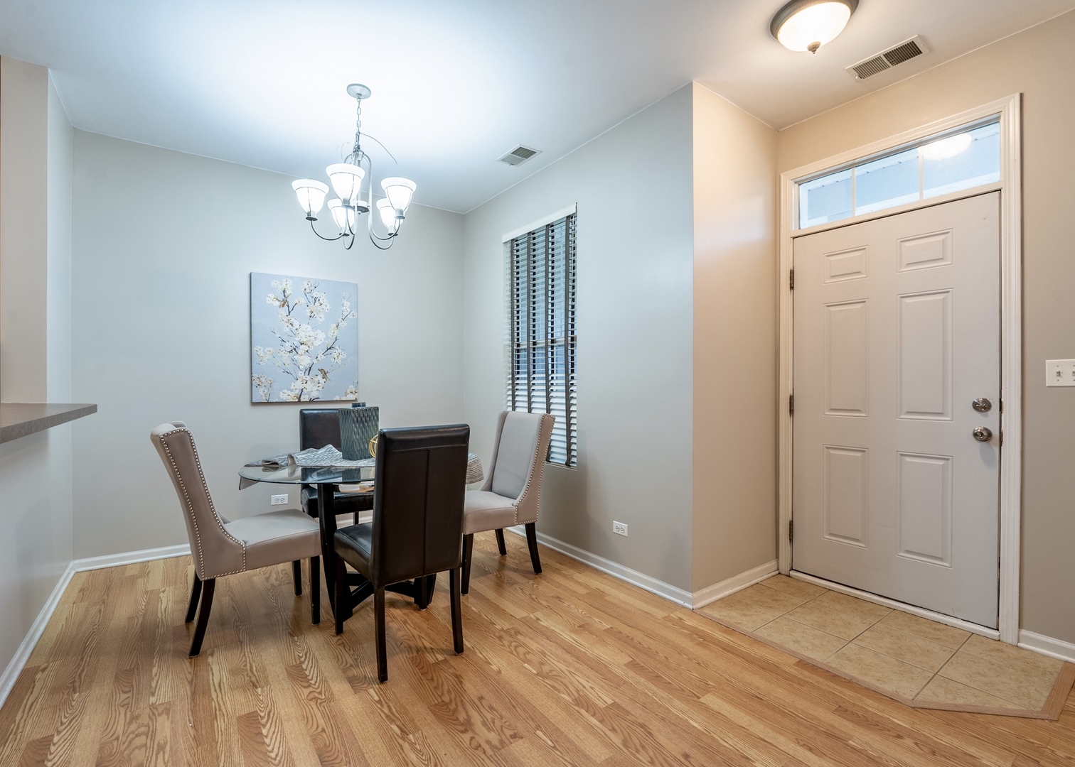 159 Springbrook Trail South Oswego, IL 60543 - Photo 11 of 32 a view of a dining room with furniture wooden floor and chandelier
