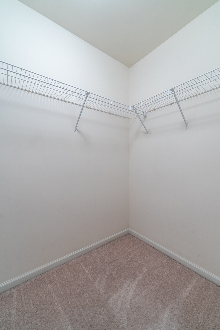 159 Springbrook Trail South Oswego, IL 60543 - Photo 24 of 32 a view of a room with racks on the wall