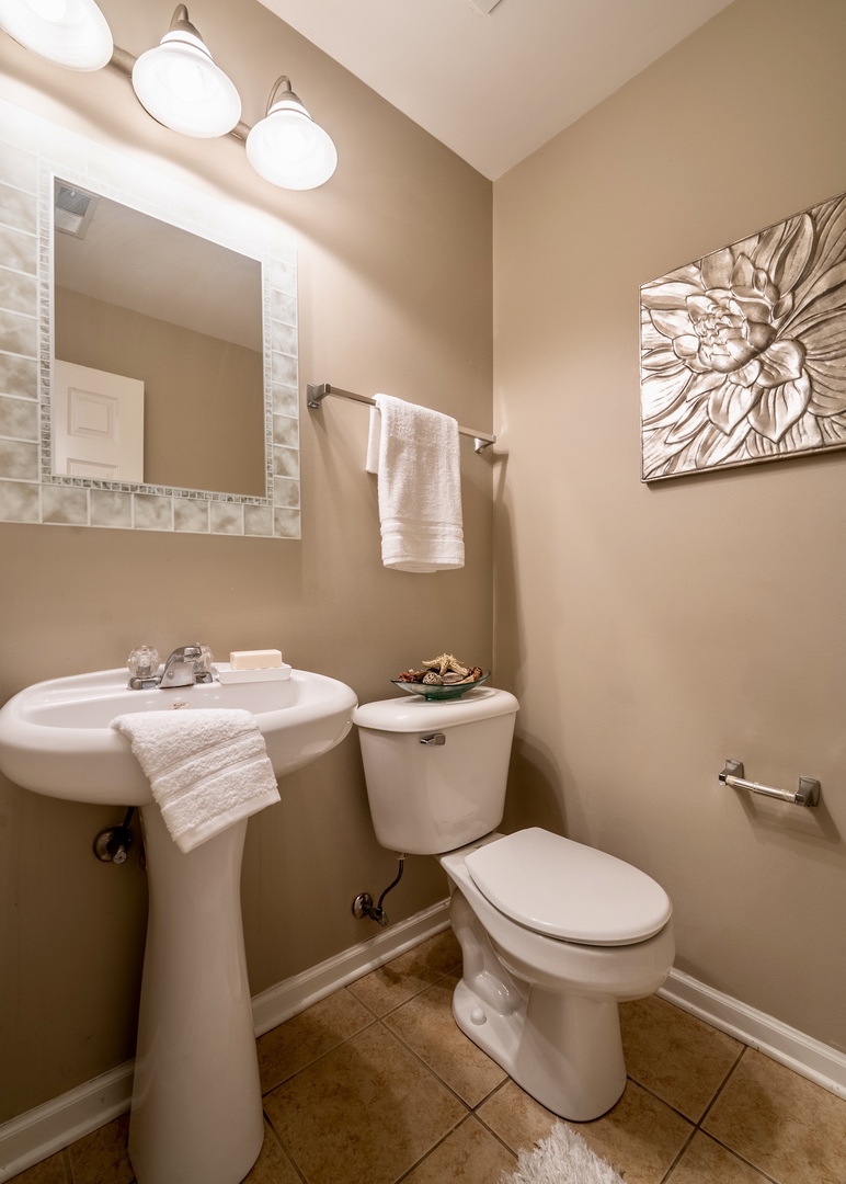 159 Springbrook Trail South Oswego, IL 60543 - Photo 28 of 32 a bathroom with a toilet sink and mirror