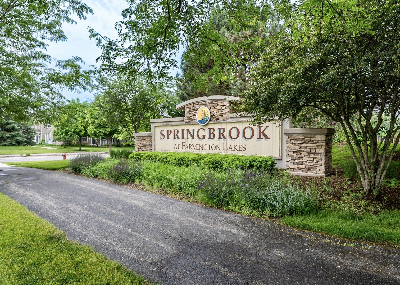 159 Springbrook Trail South Oswego, IL 60543 - Photo 31 of 32 a sign board with a park bench under large trees