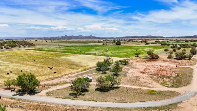 a view of a lake with houses in the back