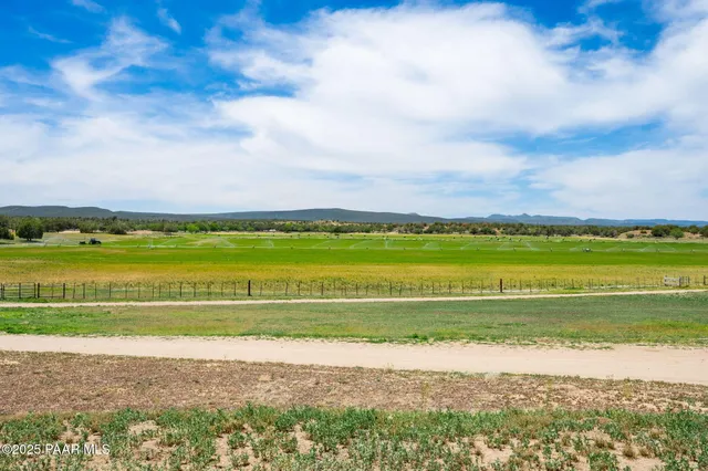 a view of a street with a building in the background