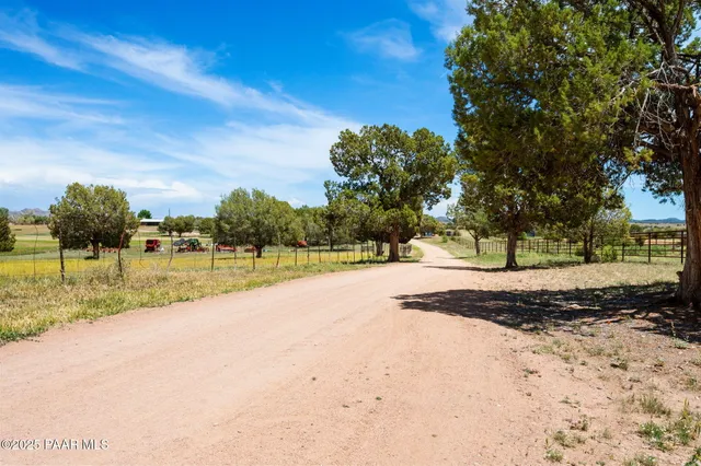 a view of a lake with a house in the background