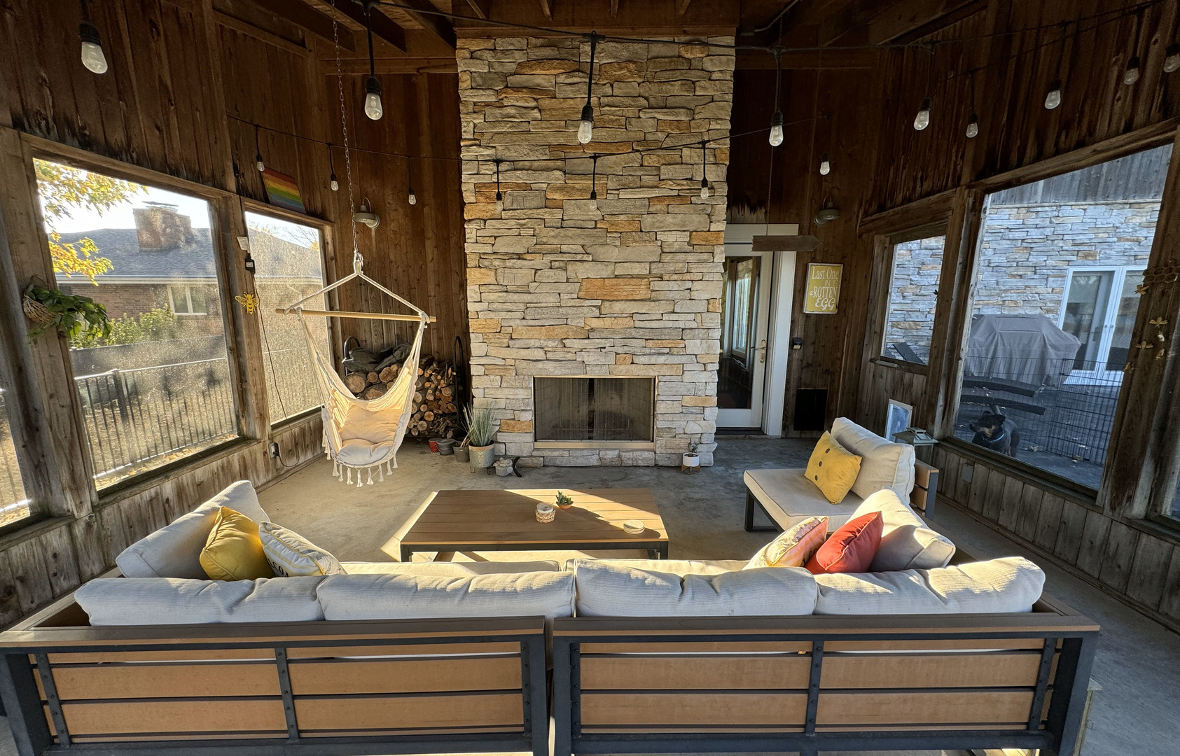 118 Pima Lane Loda, IL 60948 - Photo 16 of 50 a living room with furniture a fireplace and a floor to ceiling window