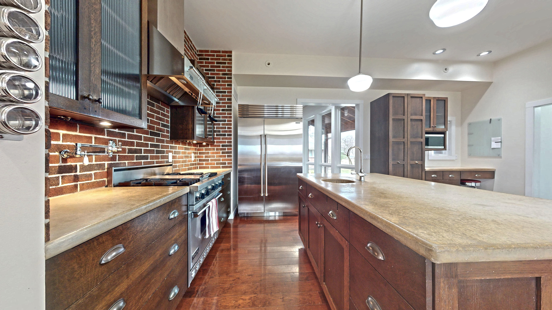 118 Pima Lane Loda, IL 60948 - Photo 7 of 50 a large kitchen with a large counter top space a sink stainless steel appliances and cabinets