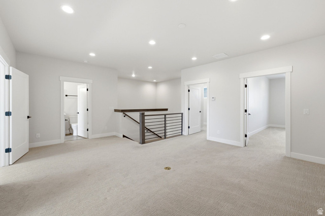 496 North Farmhouse Way, Unit 11 Midway, UT 84049 - Photo 32 of 50 Second-story landing featuring recessed lighting, light neutral carpet flooring, and a contemporary horizontal metal baluster railing